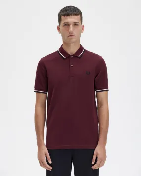 Polo mezza manica bordeaux con bordino nero e bianco